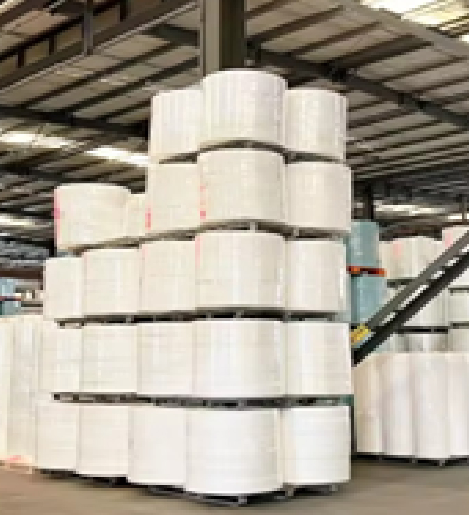 White nonwoven fabric jumbo rolls in warehouse